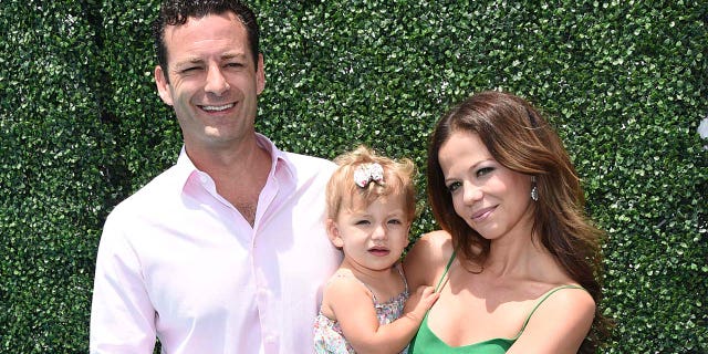 Tammin Sursok (right) said that her husband Sean McEwan (left) has had a high fever. (Photo by Michael Buckner/Getty Images for FIJI)