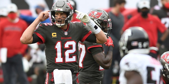 Tampa Bay Buccaneers quarterback Tom Brady (12) calls a play against the Atlanta Falcons during the second half of an NFL football game Sunday, Jan. 3, 2021, in Tampa, Fla. (AP Photo/Jason Behnken)