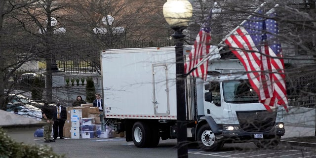 A van arrives to pick up boxes that were moved out of the Eisenhower Executive Office building. (AP)