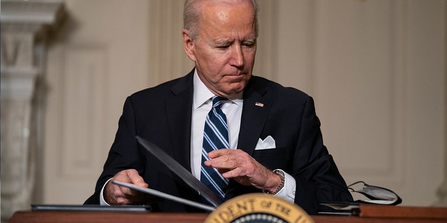 In this Jan. 27, 2021, file photo President Joe Biden signs a series of executive orders on climate change, in the State Dining Room of the White House in Washington. A number of Biden's executive branch nominees, likely including Kristen Clarke to run the Civil Rights Division of the DOJ, will be temporarily put on ice while the Senate conducts an impeachment trial beginning next week. (AP Photo/Evan Vucci, File)