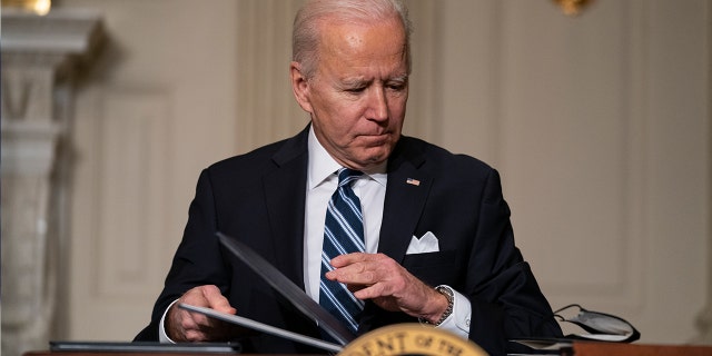 In this Jan. 27, 2021, file photo President Joe Biden signs a series of executive orders on climate change, in the State Dining Room of the White House in Washington. Biden's $1.9 trillion coronavirus stimulus plan is almost certain not to get any support from congressional Republicans. (AP Photo/Evan Vucci, File)