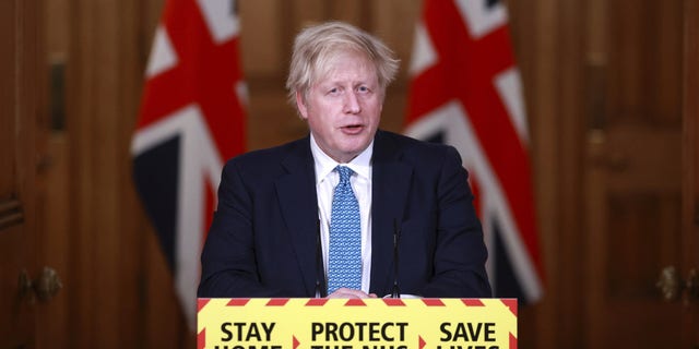 Britain's Prime Minister Boris Johnson speaks during a news conference inside 10 Downing Street in London on Tuesday.