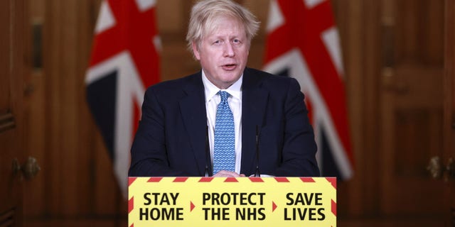 Britain's Prime Minister Boris Johnson speaks during a news conference inside 10 Downing Street in London on Tuesday.