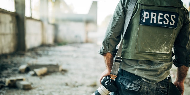 Journalist wears bulletproof vest. (iStock)