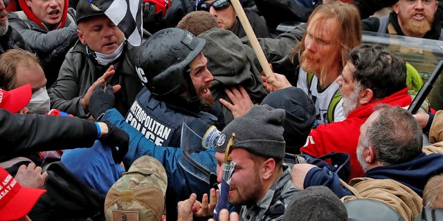 Pro-Trump protesters clash with police during the U.S. Capitol riot on Jan. 6, 2021.