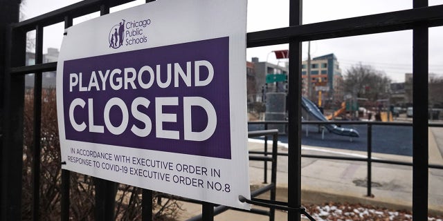 A sign hangs on a fence outside of Burr Elementary School on Jan.25 in Chicago, Illinois. (Getty Images)