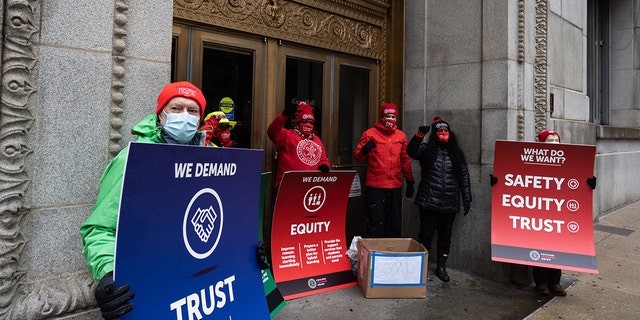 Chicago Teachers Union leaders list their demands and leave a box of coal outside the entrance to City Hall after a caravan of cars where teachers and supporters demanded a safe and fair return to learning in person during the COVID-19 pandemic in Chicago on December 12.  , 2020. (Photo by Max Herman / NurPhoto via Getty Images)