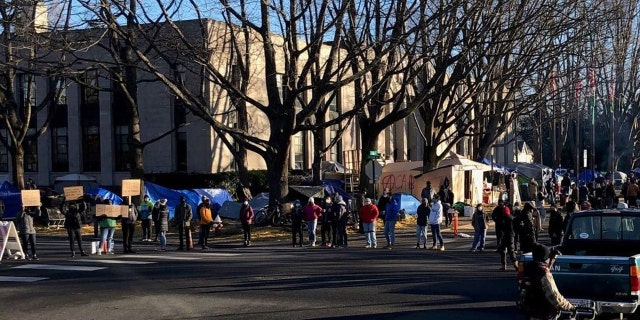 This undated photo shows protesters outside of Bellingham's City Hall where a homeless encampment has taken root.