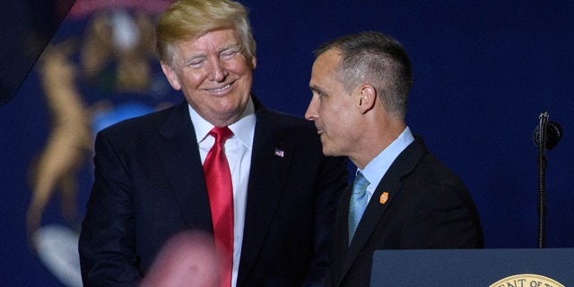 FILE - Former Trump Campaign manager Corey Lewandowski speaks as President Trump looks on during a rally at Total Sports Park in Washington, Michigan on April 28, 2018. (Photo: MANDEL NGAN/AFP via Getty Images)
