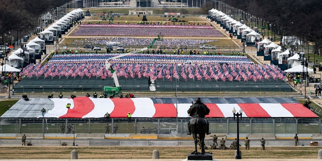 The National Mall is filled with a display of flags, as seen during a rehearsal for the 59th Presidential Inauguration at the U.S. Capitol in Washington, on Monday. (AP/The New York Times)