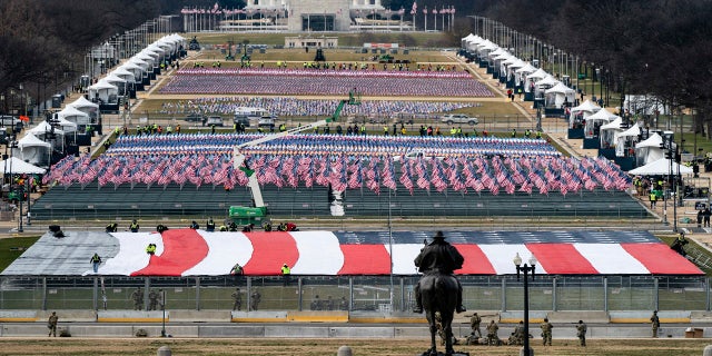 The National Mall is filled with a display of flags, as seen during a rehearsal for the 59th Presidential Inauguration at the U.S. Capitol in Washington, on Monday. (AP/The New York Times)