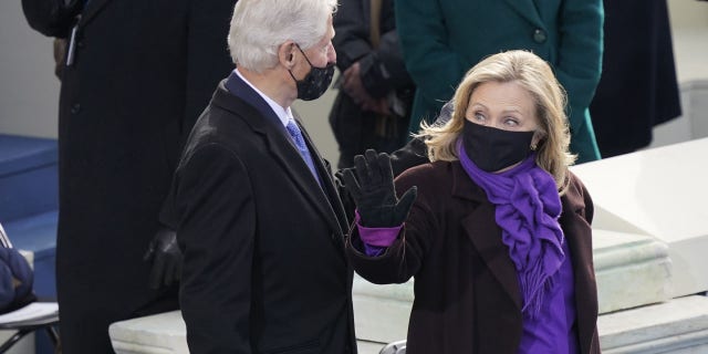 Former President Bill Clinton and former Secretary of State Hillary Clinton arrive for the 59th Presidential Inauguration at the U.S. Capitol in Washington, Wednesday, Jan. 20, 2021.