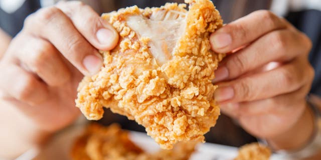 Hand holding Fried chicken and eating in the restaurant (iStock) "…fried foods are higher in fat, salt, and calories, all of which are horrible for heart health and the risk of developing obesity," says registered dietitian Angela L. Lago.