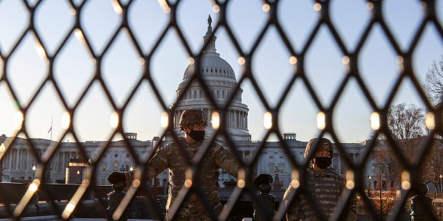 U.S. National Guard troops stand guard at the U.S. Capitol on Jan. 12, in Washington, DC. The Pentagon is deploying as many as 15,000 National Guard troops to protect President-elect Joe Biden's inauguration on January 20, amid fears of new violence. (Photo by Tasos Katopodis/Getty Images)