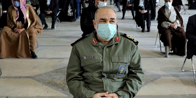 Head of the Iranian Revolutionary Guard, Genl.  Hossein Salami, wearing a mask, attends a ceremony commemorating the first anniversary of the death of the late Iranian General of the Revolutionary Guards Corps (IRGC) and Commander of the Quds Force Qasem Soleimani, in Tehran, Iran, Friday , January 1, 2021. (Associated Press)