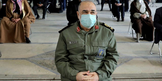 Head of the Iranian Revolutionary Guard, Genl.  Hossein Salami, wearing a mask, attends a ceremony commemorating the first anniversary of the death of the late Iranian General of the Revolutionary Guards Corps (IRGC) and Commander of the Quds Force Qasem Soleimani, in Tehran, Iran, Friday , January 1, 2021. (Associated Press)