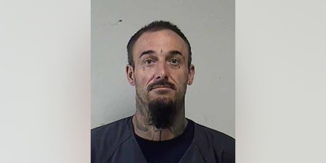 Joshua Ziminski, 35, of Racine, was charged with arson, disorderly conduct with a dangerous weapon and obstructing an officer. (Kenosha County Sheriff's Office)