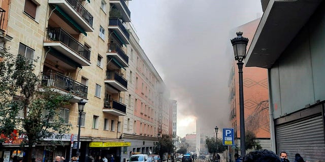 A loud explosion of unknown origin has partially destroyed a six-floor-tall building flanked by a school and a nursing home in the center of Spain's capital, Madrid. (Europa Press via AP)