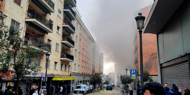 A loud explosion of unknown origin has partially destroyed a six-floor-tall building flanked by a school and a nursing home in the center of Spain's capital, Madrid. (Europa Press via AP)