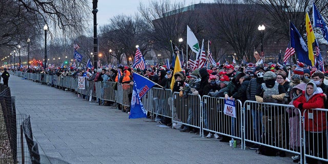 People wait for a rally of supporters of President Donald Trump challenging the results of the 2020 U.S. Presidential election on the Ellipse outside of the White House on January 6, 2021 in Washington, DC. (Photo by Brendan Smialowski/AFP via Getty Images)
