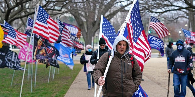 Supporters of US President Donald Trump challenging the results of the 2020 US Presidential election arrive for a rally on the Ellipse outside of the White House on January 6, 2021 in Washington, DC. (Photo by Alex Edelman / AFP) (Photo by ALEX EDELMAN/AFP via Getty Images)