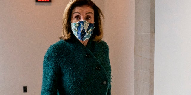 House Speaker Nancy Pelosi of Calif., arrives for a news conference on Capitol Hill in Washington, Thursday, Jan. 28, 2021. (AP Photo/Andrew Harnik)