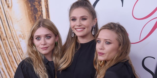Elizabeth Olsen (center) and Mary-Kate (R) and Ashley Olsen (L).