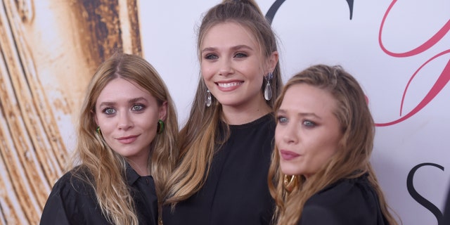 Elizabeth Olsen (center) and Mary-Kate (right) and Ashley Olsen (left).