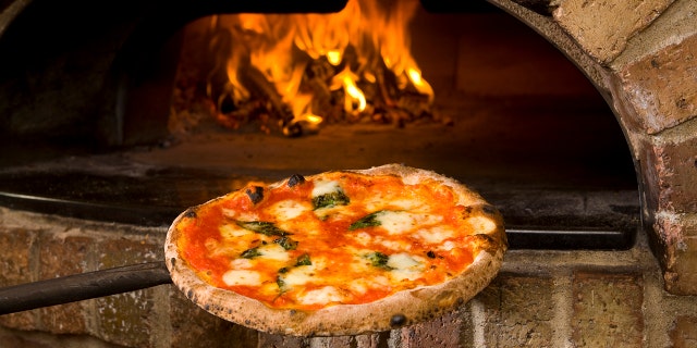 A New York City pizzeria is under fire for its owner's racist remarks on the restaurant review website Yelp. (iStock).