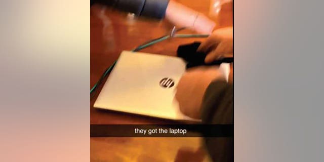 Another video allegedly recorded by Williams showed the Hewlett-Packard laptop on a wooden desk. (Justice Department)