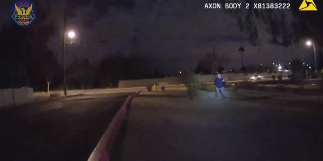 Crawford ignored officers and continued to walk backward with his hand behind his back. He can be heard several times saying, "Who's going to kill someone tonight?"