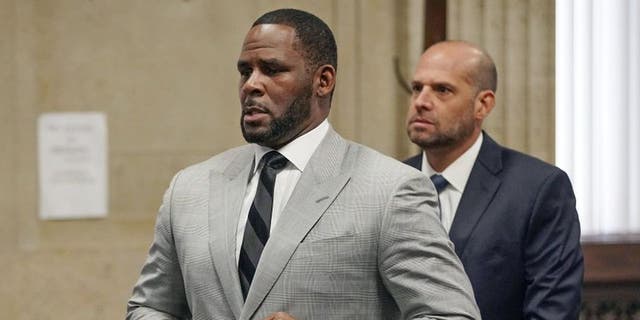 In this June 6, 2019, file photo, singer R. Kelly pleaded not guilty to 11 additional sex-related crimes during a hearing before Judge Lawrence Flood at the Leighton Criminal Court Building in Chicago.