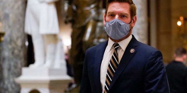 Charging Official Eric Swalwell, D-Calif. Representative walks Capitol Hill in Washington on Wednesday, January 13, 2021 (AP Photo / Susan Walsh)