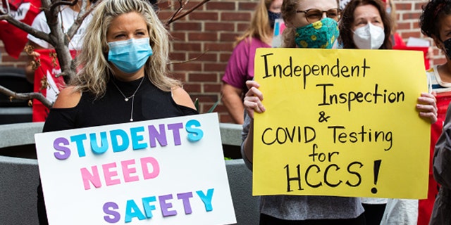 Teachers and members of the PSC CUNY union hold placards during a strike outside Hunter Campus High School in New York, United States, Wednesday, September 16, 2020 (Photo: Paul Frangipane / Bloomberg via Getty Images)