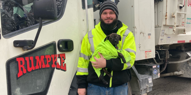 Aaron Kinsel was working Wednesday morning when he noticed a bag moving on the side of the road and went to investigate. A 10-week-old boxer-mix puppy was inside. (Rumpke)