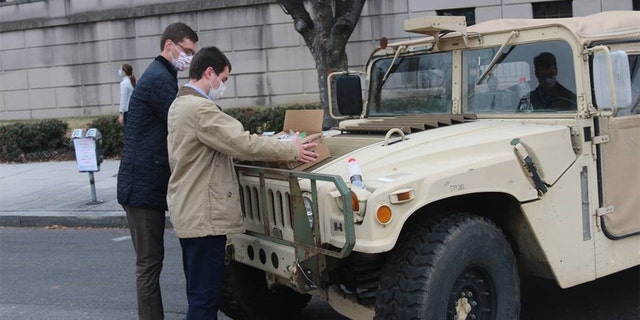 Sen. Pat Toomey's staff prepare to distribute candy care packages on Jan. 15, 2021, to National Guard members stationed in force at the Capitol.