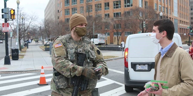 A staffer for Sen. Pat Toomey, R-Penn., delivers candy care packages to members of the National Guard on Friday.