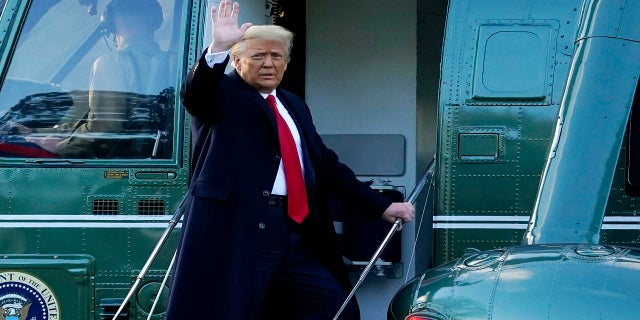 President Donald Trump waves as he boards Marine One on the South Lawn of the White House, on his final day in office, Jan. 20, 2021. Trump was heading to his Mar-a-Lago, Florida, resort.