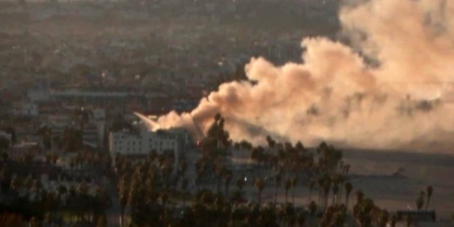 The fire started in a nearby homeless encampment, according to the Los Angeles Fire Department.