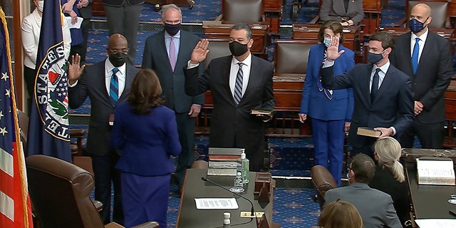 In this image from video, Vice President Kamala Harris swears in Sen. Raphael Warnock, D-Ga., Sen. Alex Padilla, D-Calif., and Sen. Jon Ossoff, D-Ga., on the floor of the Senate Wednesday, Jan. 6, 2021, on Capitol Hill in Washington. 