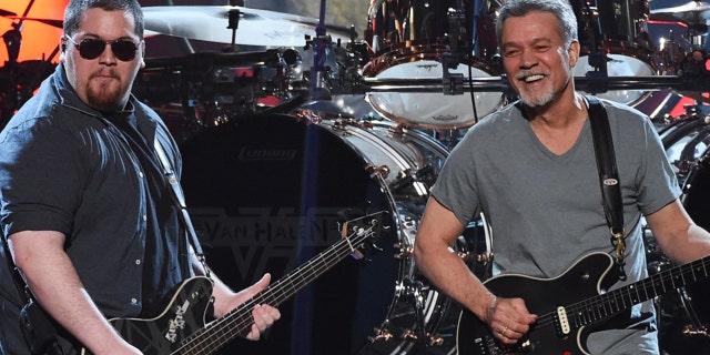 Wolf Van Halen, left, wrote a moving tribute to his late father, Eddie Van Halen, to commemorate what would have been the rocker's 66th birthday on Tuesday.  Eddie Van Halen died aged 65 in October.