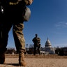 Armed members of the National Guard stand guard outside the Capitol Building on Capitol Hill in Washington, Thursday, Jan. 14, 2021. (AP Photo/Andrew Harnik)