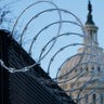 Razor wire is on top of security fencing that surrounds the U.S. Capitol in Washingtonahead of the 59th Presidential Inauguration. (AP Photo/Susan Walsh)