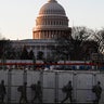 National Guardsmen deploy inside the security perimeter surrounding the Capitol ahead of President-elect Joe Biden's inauguration ceremony, Tuesday, Jan. 19, 2021, in Washington.