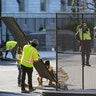 Fencing is placed around the exterior of the Capitol grounds, Thursday morning, Jan. 7, 2021 in Washington. The House and Senate certified the Democrat's electoral college win early Thursday after a violent throng of pro-Trump rioters spent hours Wednesday running rampant through the Capitol. A woman was fatally shot, windows were bashed and the mob forced shaken lawmakers and aides to flee the building, shielded by Capitol Police. (AP Photo/Julio Cortez)