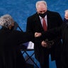Former Democratic National Committee Chairwoman Donna Brazile, left, greeting former Vice President Dan Quayle, right, as House Minority Whip Steve Scalise, R-La., center, looks on as they arrive at the 59th Presidential Inauguration at the U.S. Capitol in Washington, Wednesday, Jan. 20, 2021. Brazile was invited to the inauguration as Scalise's guest