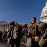 Members of the National Guard walk past the Dome of the Capitol Building on Capitol Hill in Washington, Thursday, Jan. 14, 2021. (AP Photo/Andrew Harnik)