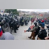 U.S. Capitol Police push back demonstrators who were trying to enter the U.S. Capitol on Wednesday, Jan. 6, 2021, in Washington.