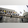 Supporters of President Trump climb the west wall of the the U.S. Capitol on Wednesday, Jan. 6, 2021, in Washington.