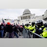 Trump supporters try to break through a police barrier, Wednesday, Jan. 6, 2021, at the Capitol in Washington. As Congress prepares to affirm President-elect Joe Biden's victory, thousands of people have gathered to show their support for President Trump and his claims of election fraud.